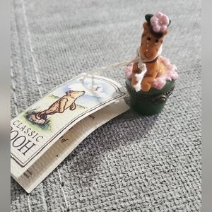 Classic Pooh Figurine with Pink and Green Accents